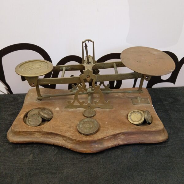 Vintage Waterlow & Sons brass balance scales with weights.