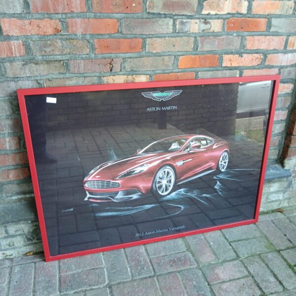 Large framed print of a red 2012 Aston Martin Vanquish.