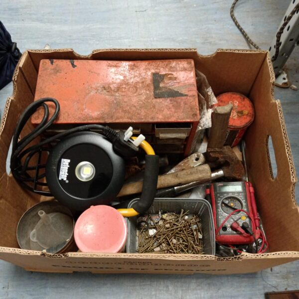 Mixed tool lot featuring a Defender LED light and test meter.