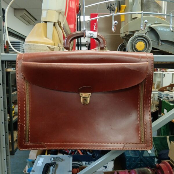 Rich brown vintage leather briefcase, classic mid-century style.