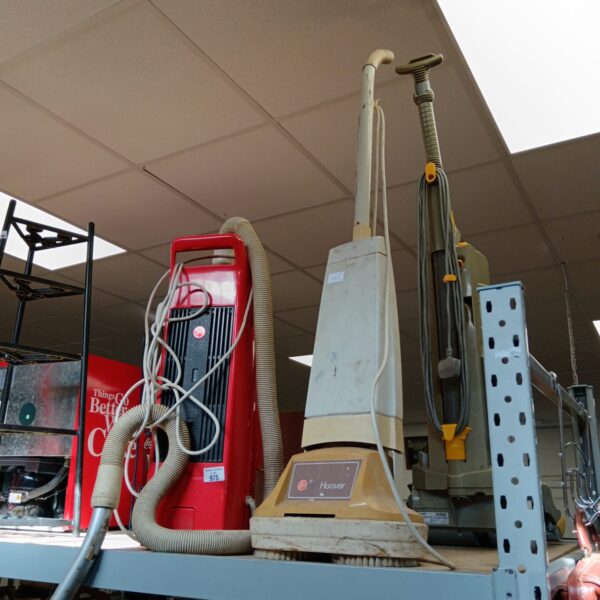 Vintage Hoover floor polisher with hose attachment.