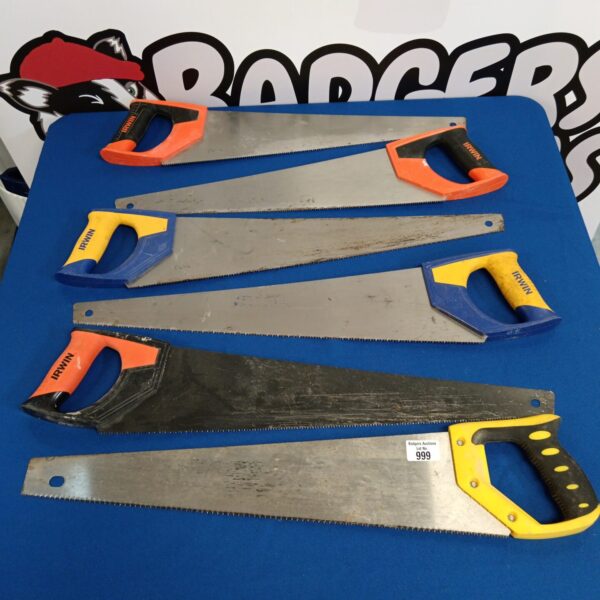 Bundle of vintage hand saws including an Irwin saw.