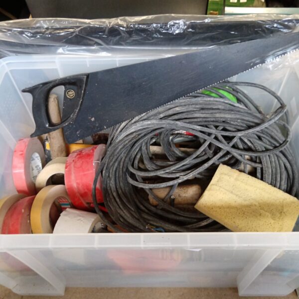 Mixed tool lot with saws, tape measure, and various hardware items.