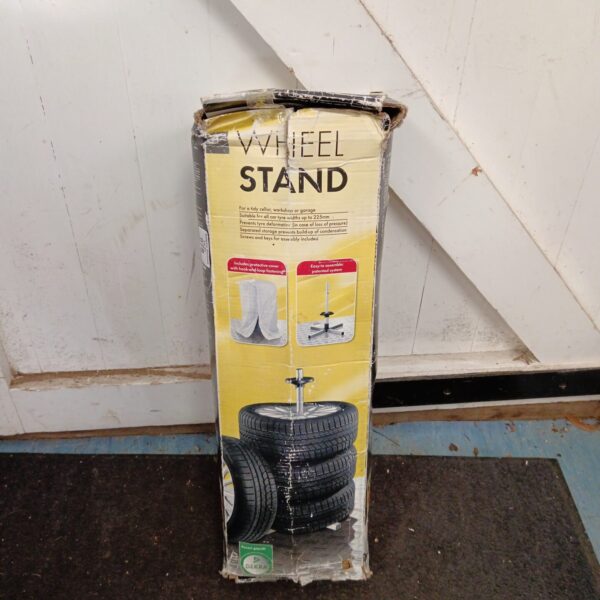 Metal Dekra wheel stand for tyre storage in garage.