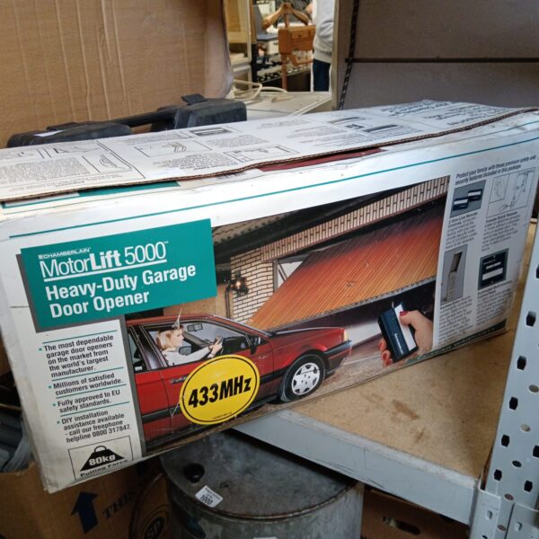 Used Chamberlain Motorlift 5000 garage door opener with packaging.