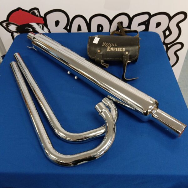 Vintage Royal Enfield exhaust and leather bag for classic motorcycles.