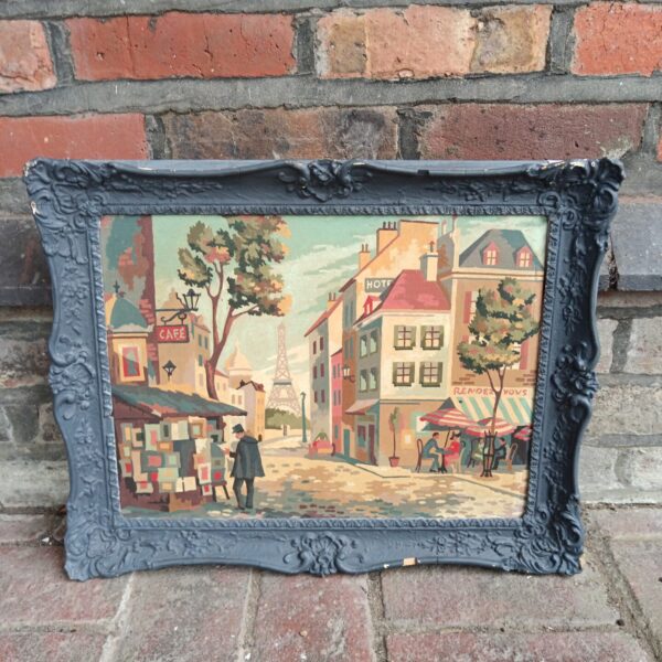 Vintage Paris street scene painting with a bustling cafe.