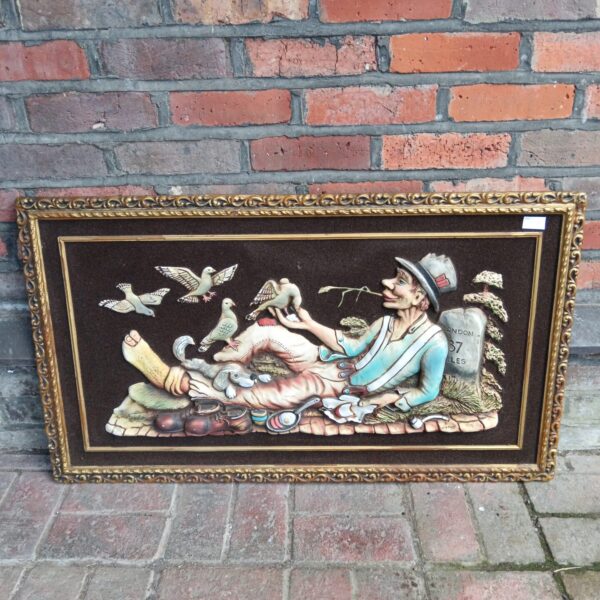 Vintage 3D artwork of a hobo feeding pigeons, detailed relief sculpture.