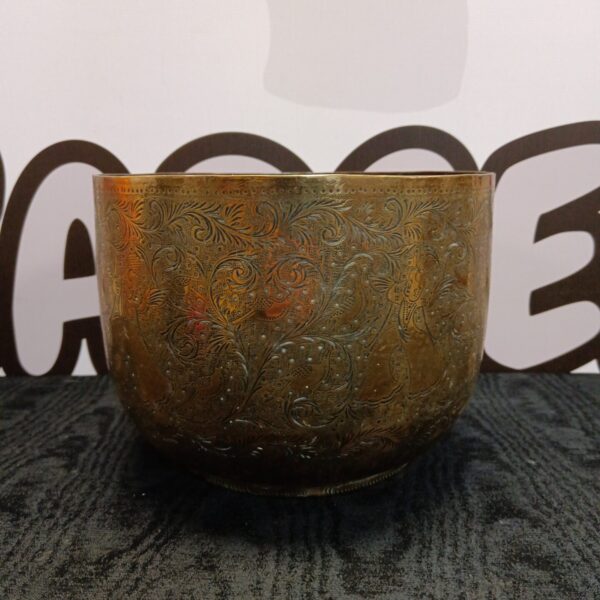 Intricate antique Indian brass bowl with a dancer design.