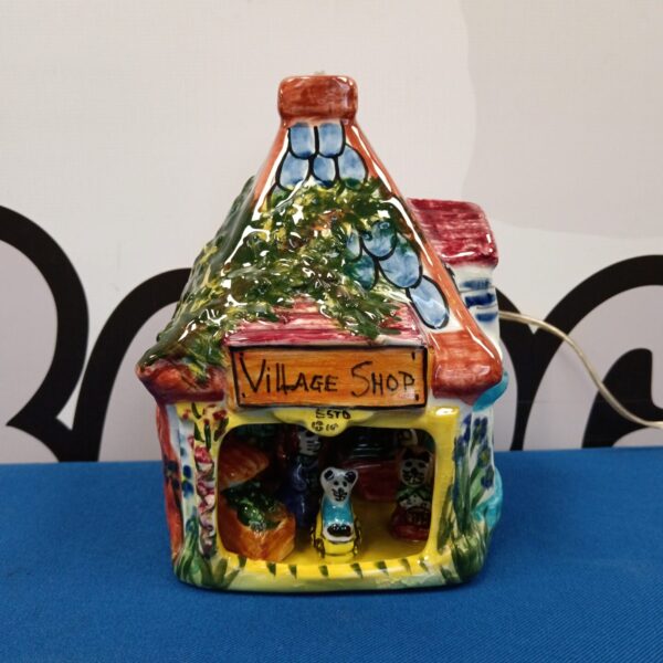 Vintage Derek Fowler village shop lamp with colourful ceramic details.