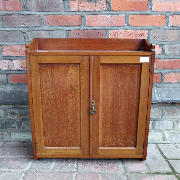 Small vintage wooden wall cabinet with key lock.