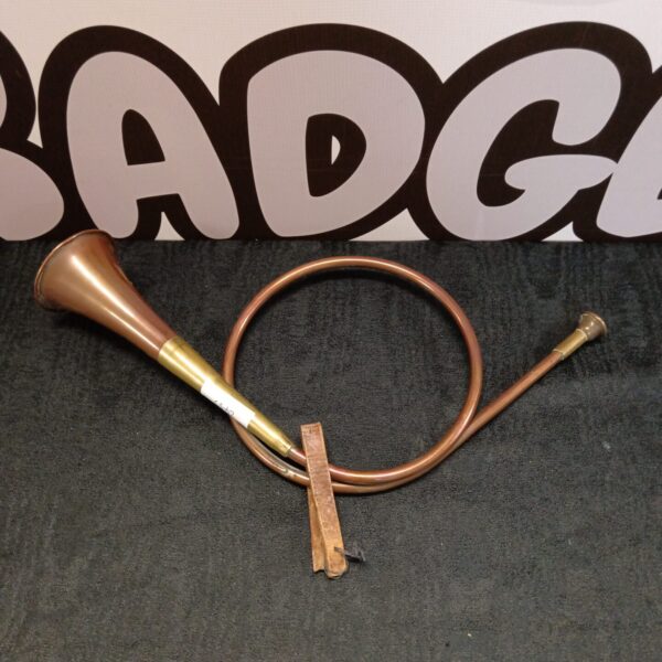 Vintage copper hunt horn, antique musical instrument for collectors.