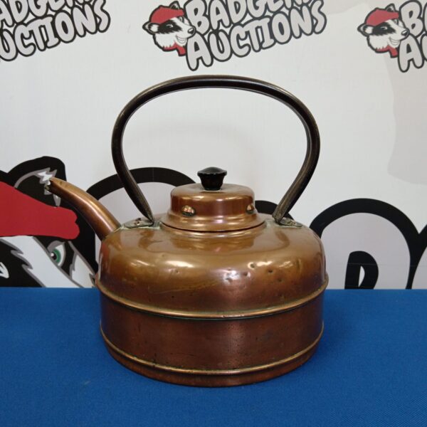 Vintage copper kettle with a classic design, ideal for collectors.