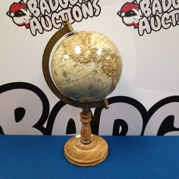 Vintage desktop globe with detailed world map.