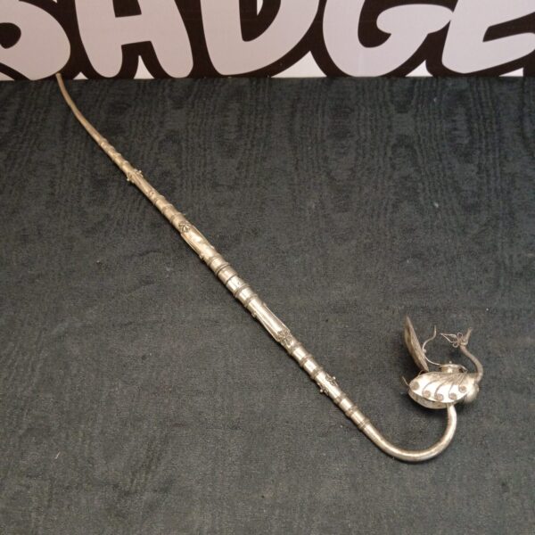 Ornate antique Persian opium pipe crafted from white metal.