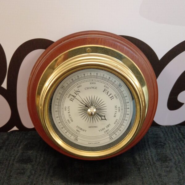 Vintage Metamec barometer showing weather forecast dial.