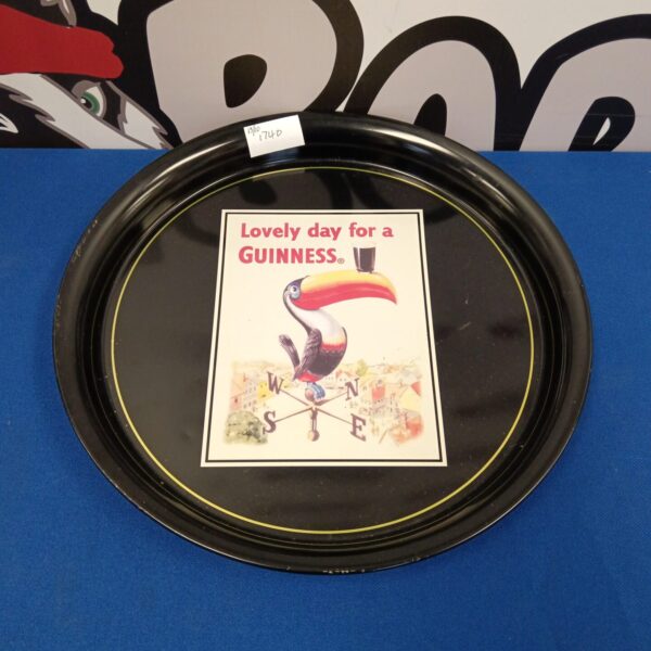 Vintage Guinness advertising tray with classic branding.