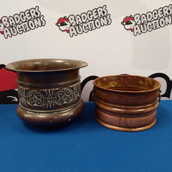 Pair of vintage copper plant pots with patina.