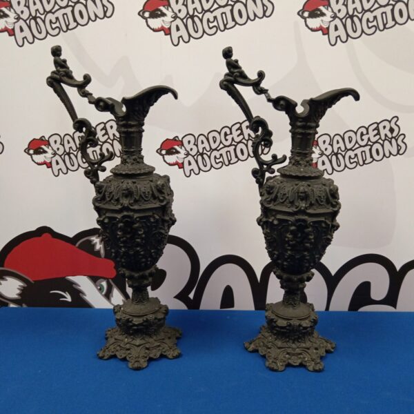 Antique cast iron ewer pair with Gothic detailing.