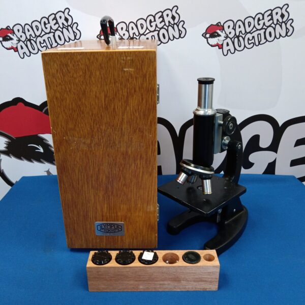 Vintage Olympus Tokyo microscope with brass detailing.