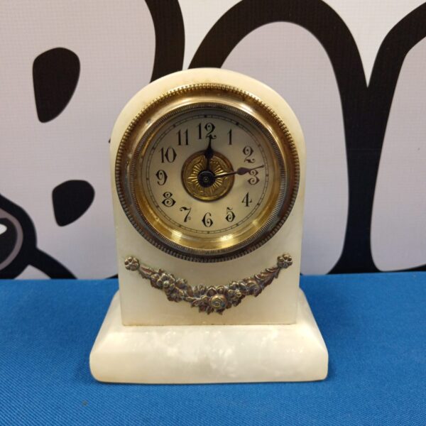 Vintage marble mantle clock with silver dial.