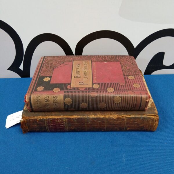 Antique copy of Bunyan's Pilgrim's Progress with embossed cover.