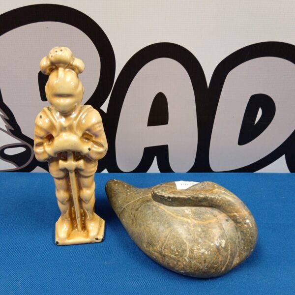 Antique cast iron knight doorstop with lustreware finish.
