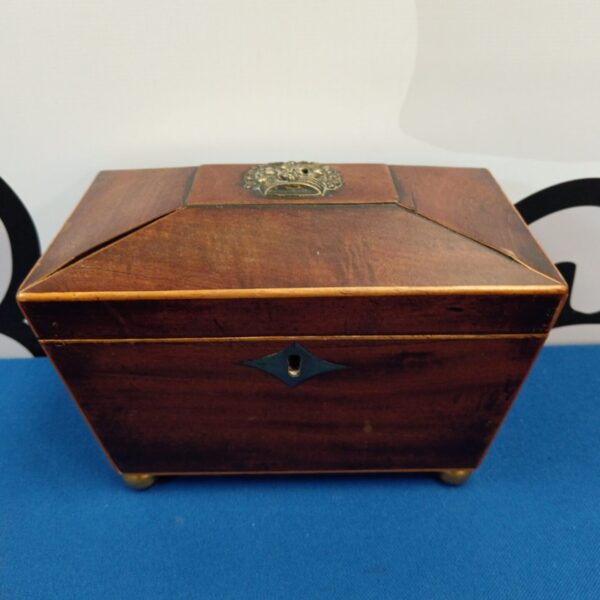 Antique Victorian tea caddy with brass inlay and keyhole lock.