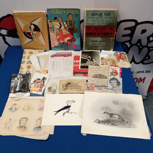 Vintage ephemera lot with old magazines and pamphlets.