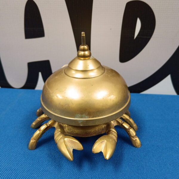 Vintage brass crab counter bell for shop or desk.