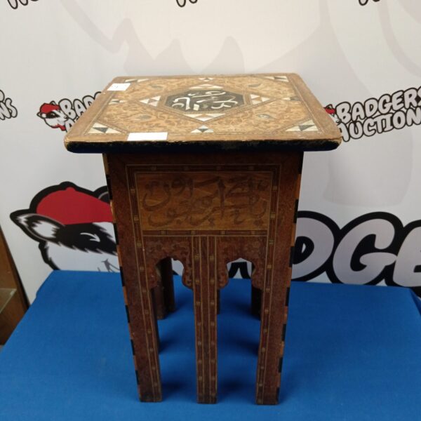Intricate Indian mother of pearl table with floral inlay.