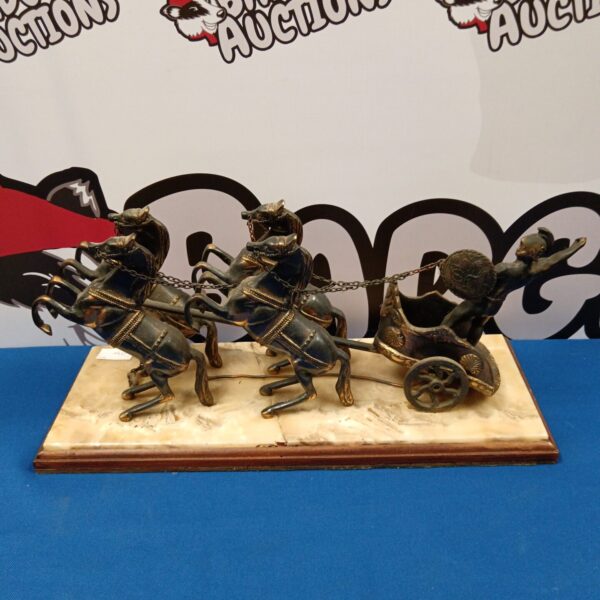 Antique brass Roman chariot sculpture on marble base.