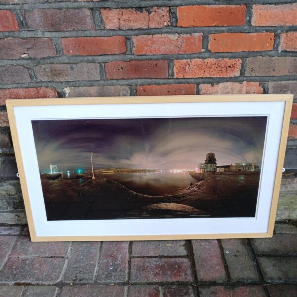 Signed Robin Wilson lighthouse photograph at night.