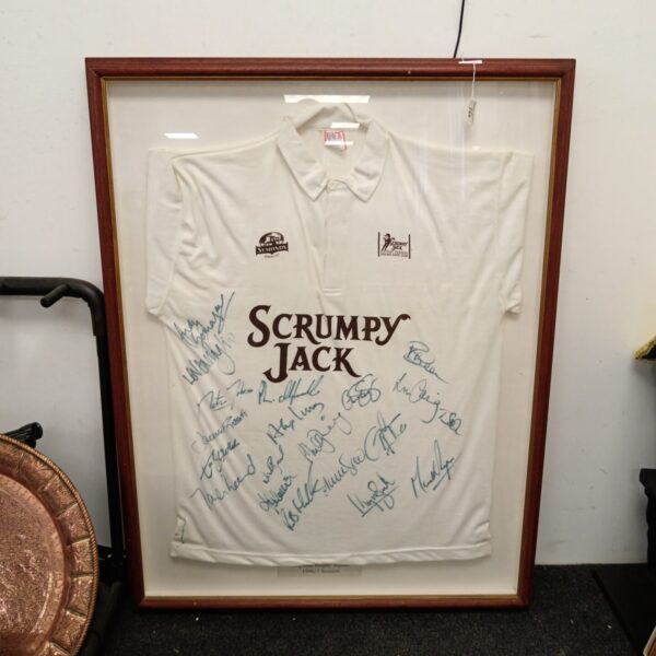 Framed signed England rugby shirt from the 1996/97 season.