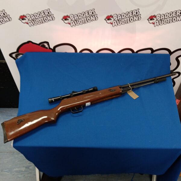Vintage Bam 0.22 calibre underlever air rifle in side view.