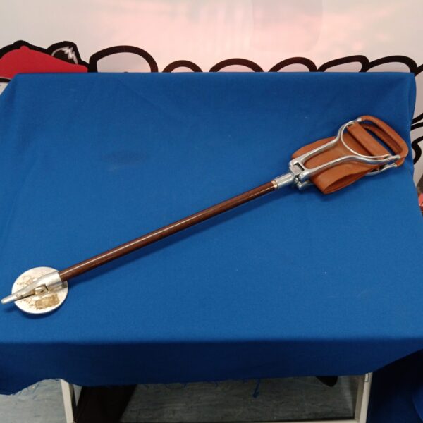 Vintage Tirion shooting stick with a leather seat for stable aiming.