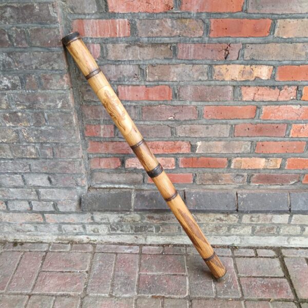 Carved bamboo didgeridoo, traditional Australian Aboriginal wind instrument.