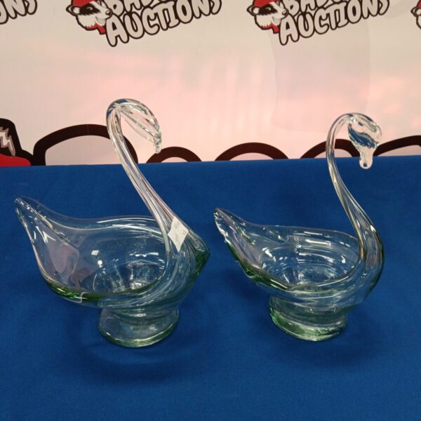 Pair of elegant hand-made glass swan dishes for serving or display.