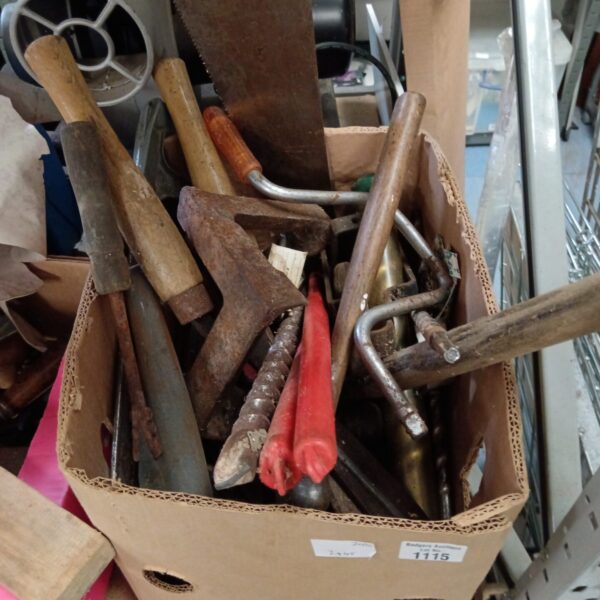 Mixed tool lot with saws and drill bits for DIY projects.