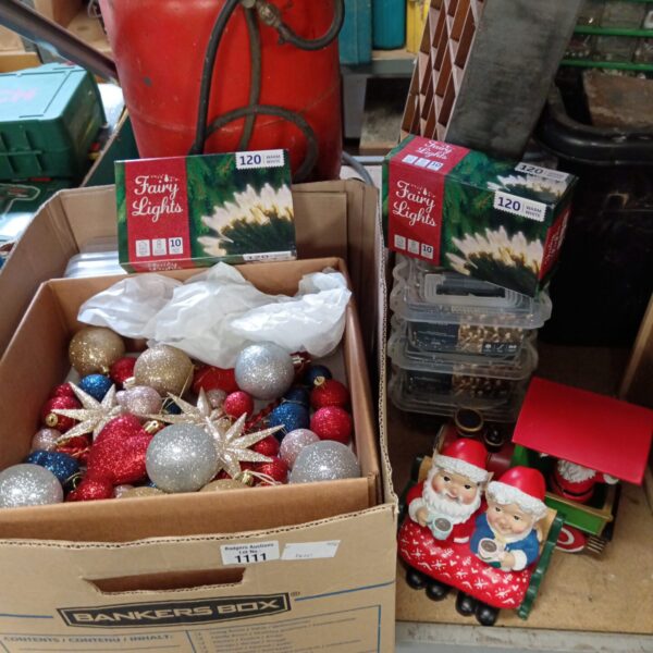 Mixed lot of Christmas decorations including baubles and fairy lights.