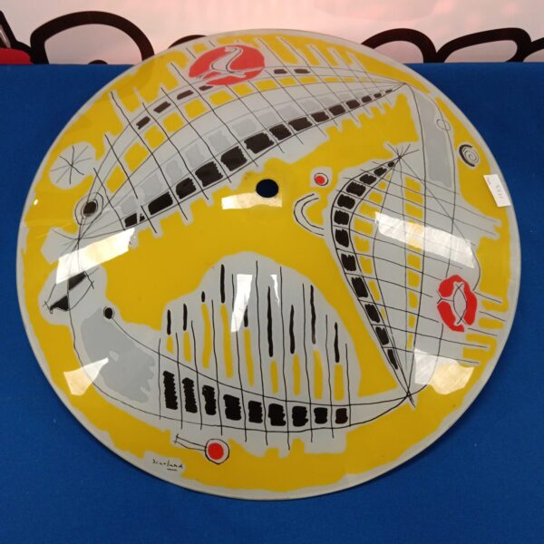 Vibrant 1960s Scarland glass light shade with geometric design.