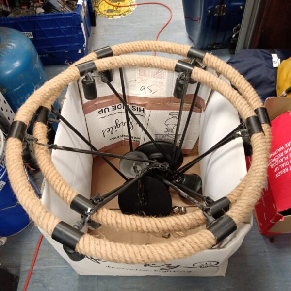 Large rope chandelier with metal frame, industrial style.