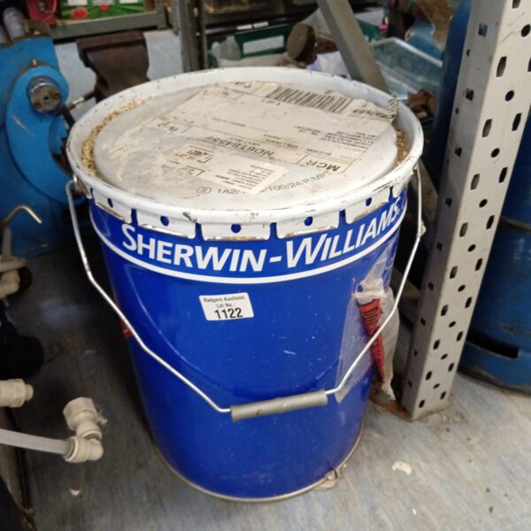 Vintage Sherwin Williams fireproof paint drum with faded labeling.
