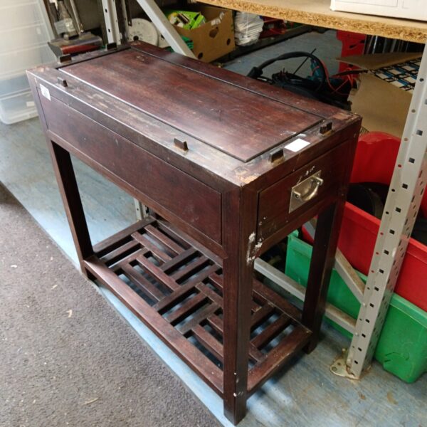 Antique Chinese table with drawer and carved details.