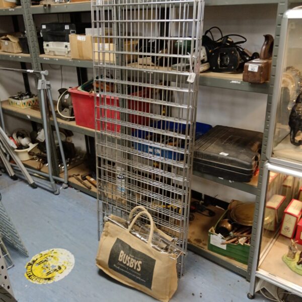 Heavy duty metal grid wall display system for retail use.