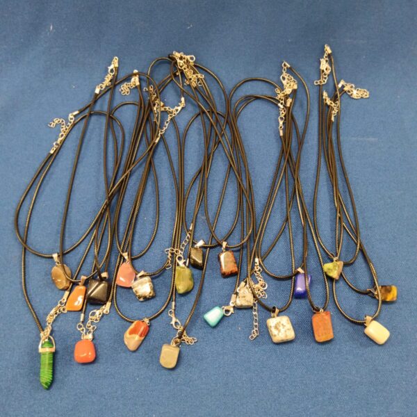 Lot of colourful semi precious stone pendant necklaces.