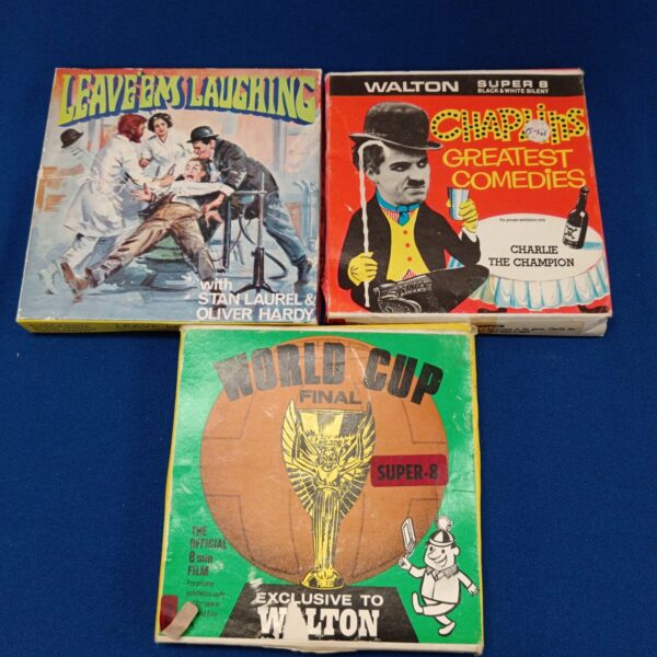 Vintage 8mm film reels featuring Chaplin and a World Cup Final.