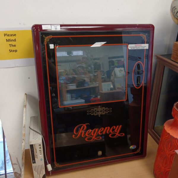Front view of a black Regency digital jukebox.