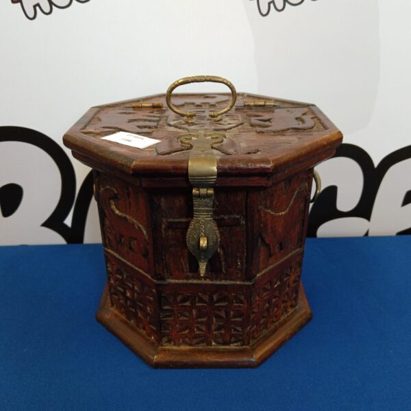 Intricately carved vintage oriental hexagon storage box with dark wood finish.