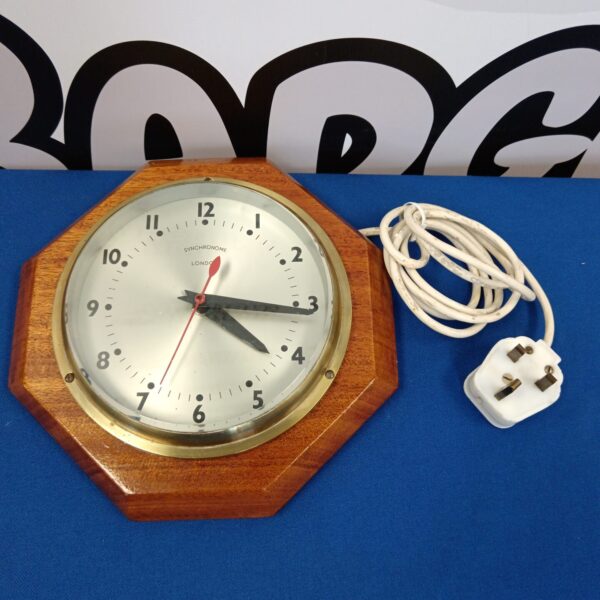 Vintage Synchronome London electric wall clock with wooden case.
